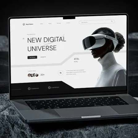 A laptop showing a clean website layout built around one large headline and a single image